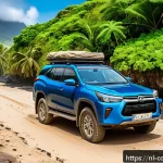 코모로 렌터카 대여 방법 - A rugged 4x4 SUV parked on a dusty, uneven dirt road in the Comoros islands, surrounded by lush trop...